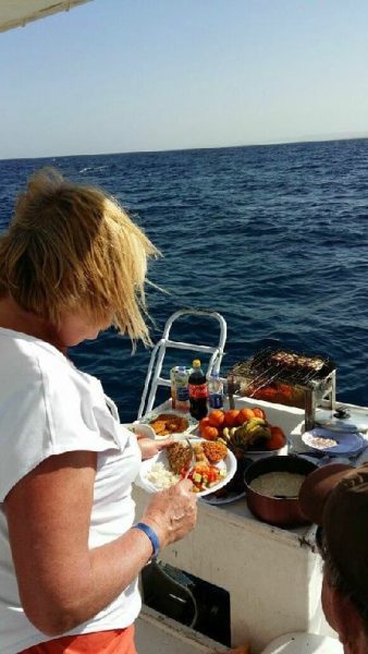 Tucking into a freshly cooked fish dish.