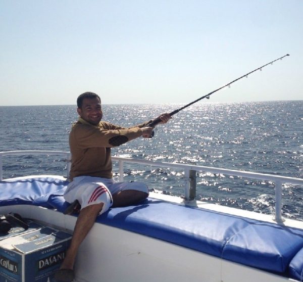 Red Sea fishing. An upbeat expectant look- there's a fish on the line.  
