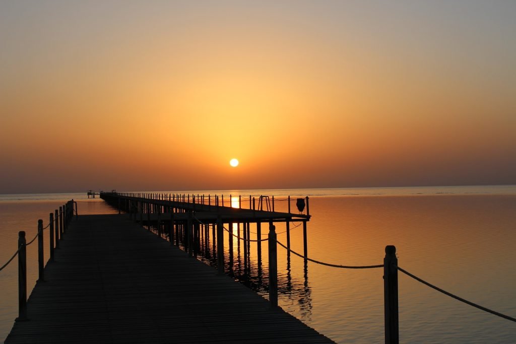 Sunrise over the Red Sea. There is a long jetty similar to this one at both Casa Blue and Casa Mare resorts