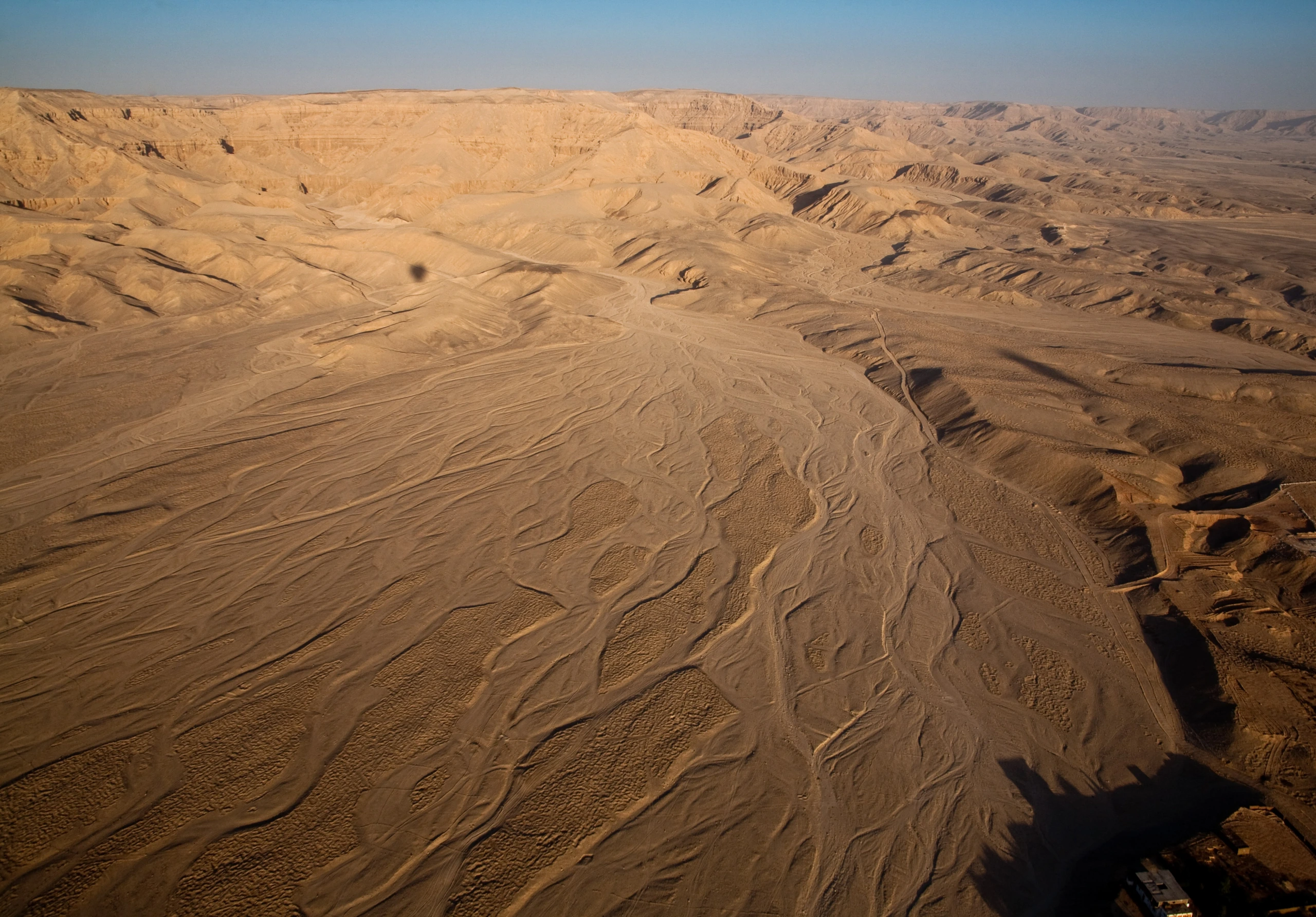 A wide flat Wadi flood plain near the usually ultra arid Valley of the Kings. Note the balloon shadow.
Photo credit: Allan Harris - CC BY-ND 2.0 - via Flickr.
