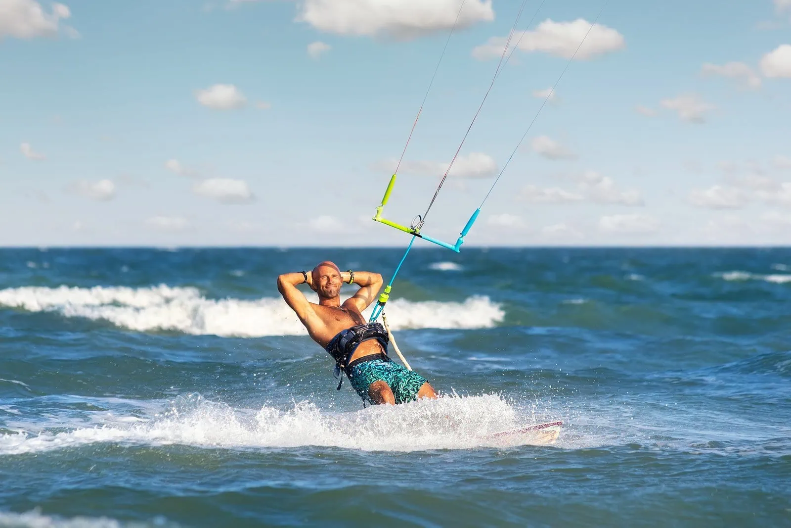 Kitesurfing is great fun under the sun. 
Photo credit: K-FK/Shutterstock.com