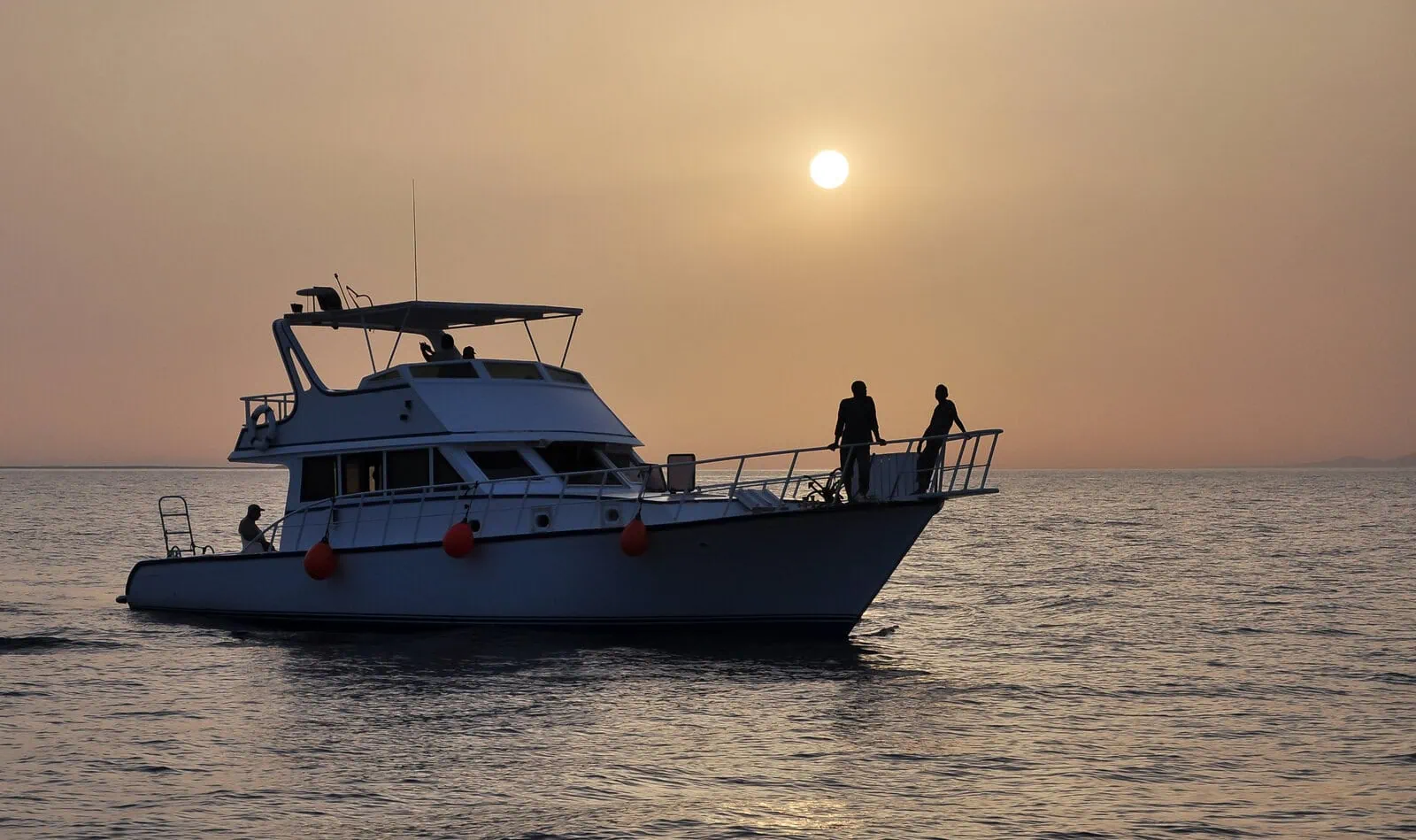 Silhouettes, stillness, sunset & Red Sea secrets. A photo of a fishing yacht at sunset off Egypt's Red Sea coast. 
Photo: Tarek-Mahmoud/Shutterstock.com