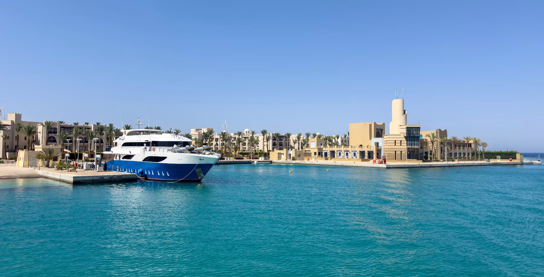 A large yacht seems to be refuelling.
Harbour Master Building on the right.
Photo: Animaflora PicsStock/Shutterstock.com