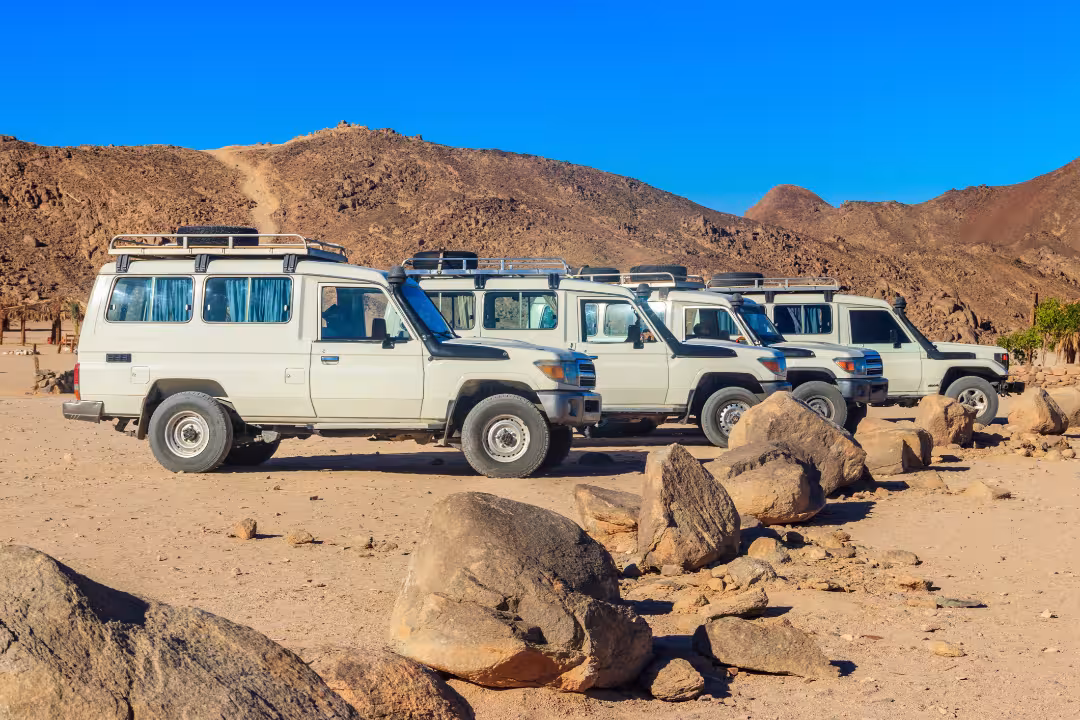Typical safari SUVs in the Eastern Desert. ID 208697022 © Olya Solodenko | Dreamstime.com. Original caption: "Off road SUV cars in bedouin village in Arabian desert near Hurghada in Egypt." Downloaded via Zero Gravity account on 2 November 2025. 